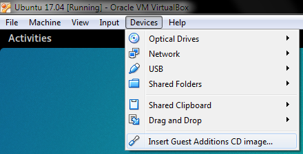 VirtualBox > Devices > Insert Guest Additions CD image...